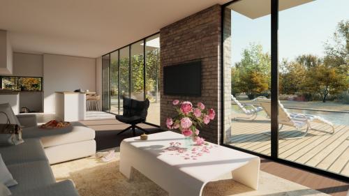 Séjour ouvert sur la terrasse et la piscine